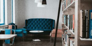 Meeting space with books and blue couch